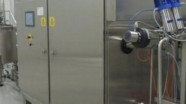 Mikrobølgepasteurisator for flytende produkter